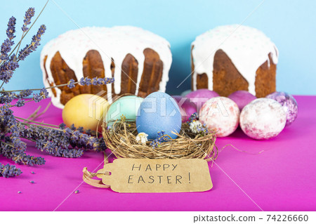 Colorful background with Easter eggs on pink and blue background. Happy Easter concept. Can be used as poster, background, holiday card. Flat lay, top view, copy space. Studio Photo Colorful background with Easter eggs on pink and blue background. Happy Easter concept. Can be used as poster, background, holiday card. Flat lay, top view, copy space. Studio Photo 74226660