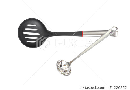 Kitchen utensils spoon with slots, slotted spoon isolated on white background. Studio Photo 74226852