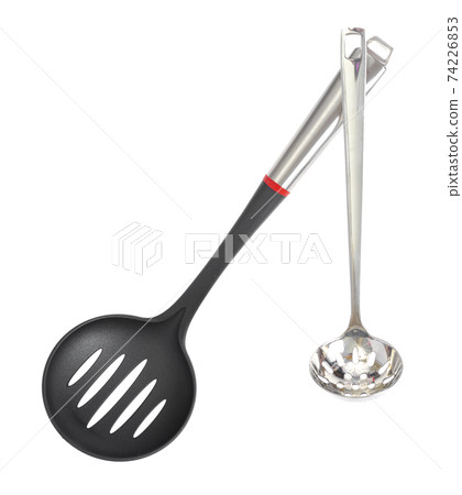 Kitchen utensils spoon with slots, slotted spoon isolated on white background. Studio Photo 74226853