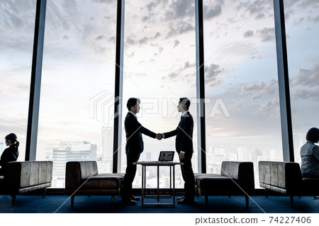 Businessman shaking hands Businessman shaking hands 74227406