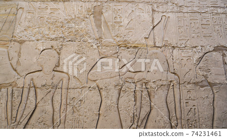 Luxor Egypt Karnak temple sandstone craved hieroglphic wall and column pharoah anceint story Luxor Egypt Karnak temple sandstone craved hieroglphic wall and column pharoah anceint story 74231461