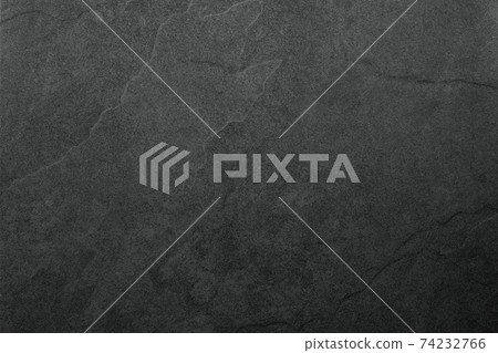 Beautiful background of a dark slate stone in close-up. Ideal for culinary or product presentation project. Beautiful background of a dark slate stone in close-up. Ideal for culinary or product presentation project. 74232766
