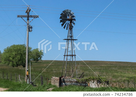 Old rustic wood windmill in sand hill pasture Nebraska Old rustic wood windmill in sand hill pasture Nebraska 74234786
