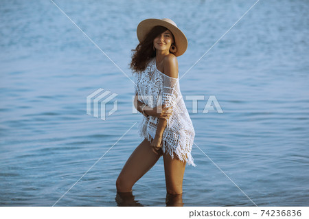 Woman Resting on the Beach During Vacation Woman Resting on the Beach During Vacation 74236836