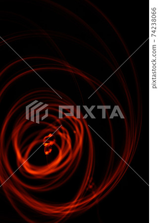 burning fire emitting sparks and embers, drawing wild energetic patterns of light, the artist's imagination with fire. 74238066