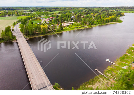 Aerial panoramic view of bridge in city Inkeroinen at river Kymijoki, Finland. 74238362
