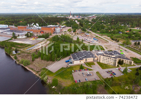 Aerial panoramic view of factory in city Inkeroinen at river Kymijoki, Finland. Aerial panoramic view of factory in city Inkeroinen at river Kymijoki, Finland. 74238472