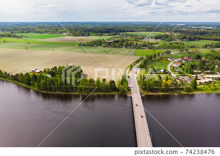 Aerial panoramic view of bridge in city Inkeroinen at river Kymijoki, Finland. Aerial panoramic view of bridge in city Inkeroinen at river Kymijoki, Finland. 74238476