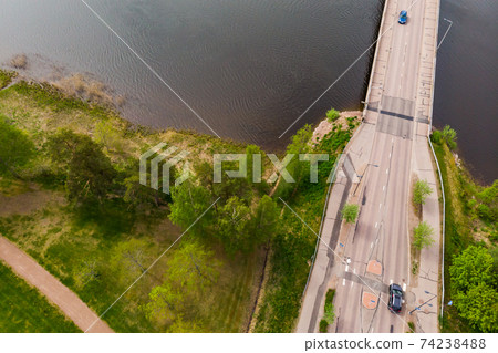 Aerial panoramic view of bridge in city Inkeroinen at river Kymijoki, Finland. Aerial panoramic view of bridge in city Inkeroinen at river Kymijoki, Finland. 74238488