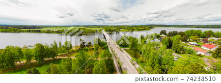 Aerial panoramic view of bridge in city Inkeroinen at river Kymijoki, Finland. Aerial panoramic view of bridge in city Inkeroinen at river Kymijoki, Finland. 74238510