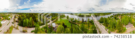 Aerial panoramic view of city Inkeroinen at river Kymijoki, Finland. Aerial panoramic view of city Inkeroinen at river Kymijoki, Finland. 74238518