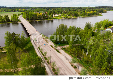 Aerial panoramic view of bridge in city Inkeroinen at river Kymijoki, Finland. Aerial panoramic view of bridge in city Inkeroinen at river Kymijoki, Finland. 74238664