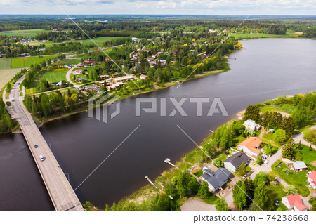 Aerial panoramic view of bridge in city Inkeroinen at river Kymijoki, Finland. Aerial panoramic view of bridge in city Inkeroinen at river Kymijoki, Finland. 74238668