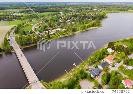 Aerial panoramic view of bridge in city Inkeroinen at river Kymijoki, Finland. Aerial panoramic view of bridge in city Inkeroinen at river Kymijoki, Finland. 74238702