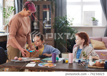 Family preparing for Easter Family preparing for Easter 74238823