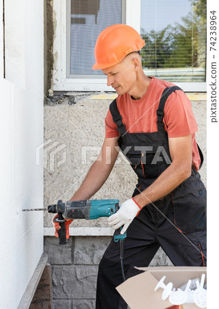 Insulation of the house with polyfoam. Insulation of the house with polyfoam. 74238964