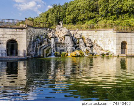 Stunning view of the three dolphins fountain, Royal Palace of Caserta, Italy 74240403