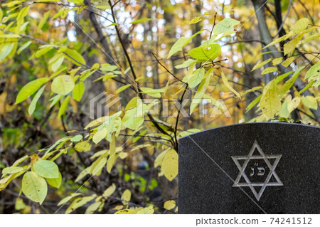 six pointed star or hexagram on tombstone. Autumn jewish Cemetery six pointed star or hexagram on tombstone. Autumn jewish Cemetery 74241512