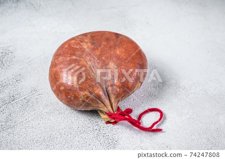 Sobrassada cured meat sausage from ground pork, paprika and spices. White background. Top view Sobrassada cured meat sausage from ground pork, paprika and spices. White background. Top view 74247808