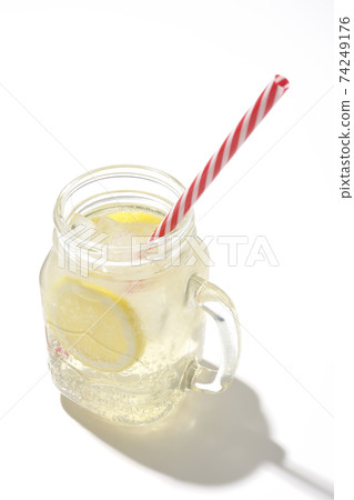 Lemon squash in a Mason jar shot on a white background 74249176