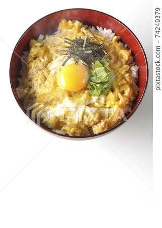 Photographed hot egg bowl with egg yolk, mitsuba, and chopped seaweed on a white background (overhead view) Photographed hot egg bowl with egg yolk, mitsuba, and chopped seaweed on a white background (overhead view) 74249379