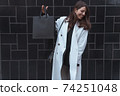 Woman hold black shopping bag fashion blogger 74251048