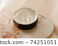 Cosmetic cream texture in a jar on pastel background 74251051