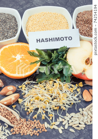 Inscription hashimoto with products and ingredients containing vitamins for healthy thyroid 74254194