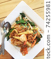noodles with shrimp and vegetables cooked in Thai style. 74255981