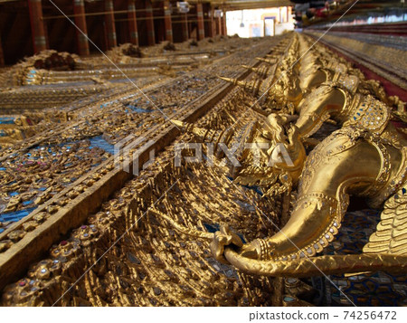 An eternal tourist destination with a row of Buddha statues on the wall of Wat Phra Kaew 74256472