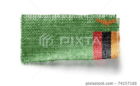 Zambia flag on a piece of cloth on a white background 74257188
