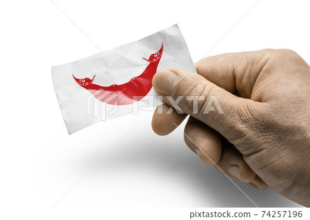 Hand holding a card with a national flag the Easter Island Hand holding a card with a national flag the Easter Island 74257196
