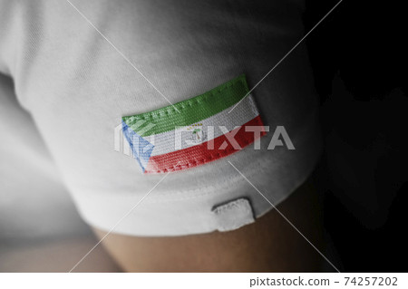 Patch of the national flag of the Equatorial Guinea on a white t-shirt Patch of the national flag of the Equatorial Guinea on a white t-shirt 74257202