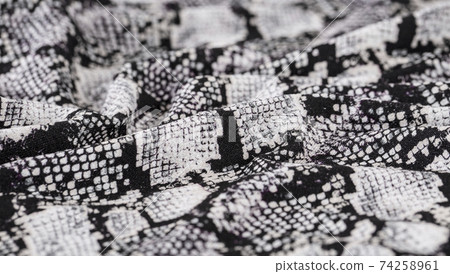 Black and white abstract camouflage. The concealment pattern on a fabric. 74258961