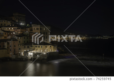The small village of Pescatori illuminated in the evening 74259745
