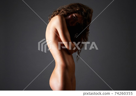 Female Silhouete. Naked girl in shadow Female Silhouete. Naked girl in shadow 74260355