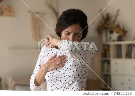 Unhealthy woman feel sick suffer from virus coughing Unhealthy woman feel sick suffer from virus coughing 74261130