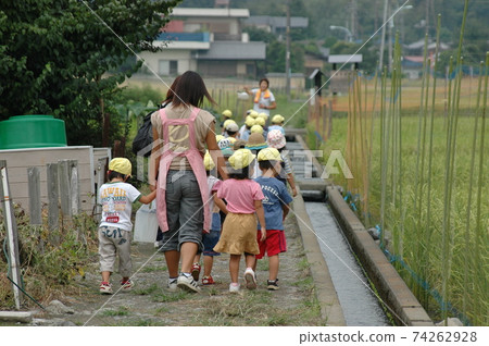 Take a walk with a nursery teacher 74262928