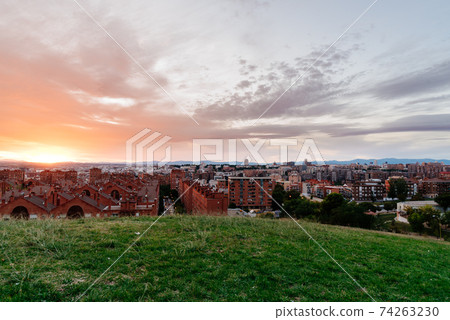 Madrid cityscape at sunset with purple clouds Madrid cityscape at sunset with purple clouds 74263230