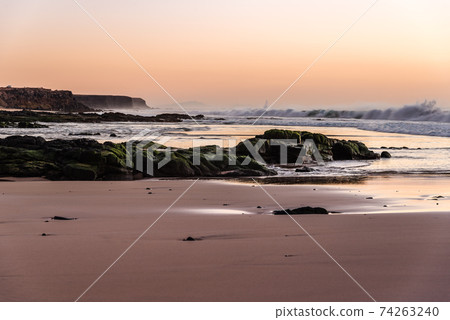 Scenic view of beach against sky during sunset Scenic view of beach against sky during sunset 74263240