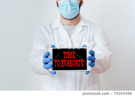 Conceptual hand writing showing Time To Evaluate Conceptual hand writing showing Time To Evaluate 74263499