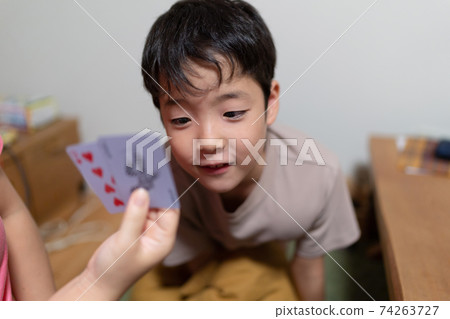 Family playing cards happily in 3 generations Family playing cards happily in 3 generations 74263727