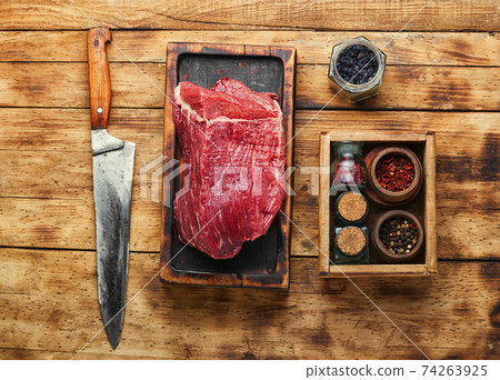 Raw veal meat with seasoning 74263925