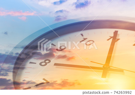 Clock face overlay with beautiful sunrise sky for good times working morning a new day concept. Clock face overlay with beautiful sunrise sky for good times working morning a new day concept. 74263992