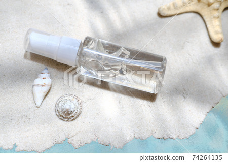after sun moisturising gel on a sand under the water. after sun moisturising gel on a sand under the water. 74264135