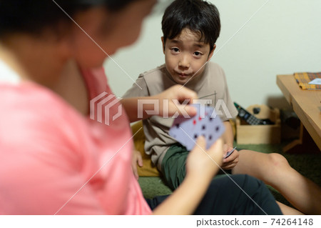 Family playing cards happily in 3 generations Family playing cards happily in 3 generations 74264148