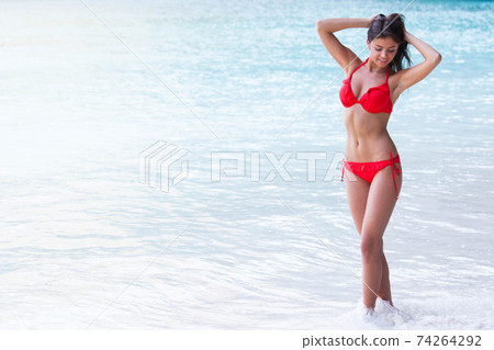 Woman on summer vacation Woman on summer vacation 74264292