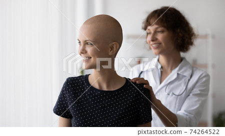 Happy doctor and female cancer patient hope for recovery 74264522