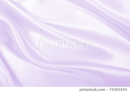 Smooth elegant lilac silk or satin texture as wedding background. Luxurious background design Smooth elegant lilac silk or satin texture as wedding background. Luxurious background design 74265854