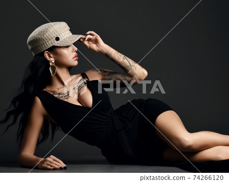 Fashionable woman with tattoo on body and arm in Fashionable woman with tattoo on body and arm in 74266120